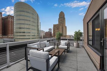 Rooftop terrace with outdoor seating and downtown views
